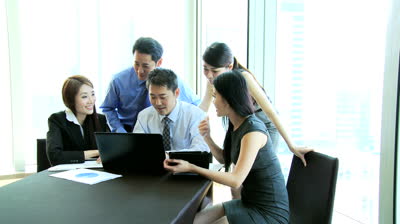 stock-footage-professional-group-young-male-female-asian-chinese-advertising-managers-collaborating-on-future